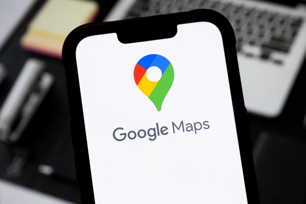 Google Maps AI-generated captions feature showing Gemini caption suggestions on a mobile phone