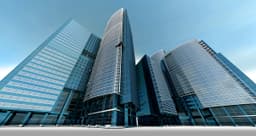 Glass bank headquarters towers, illustrating Swift ledger payments at banks using ACI Connetic