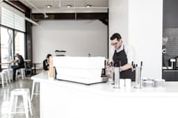 Square for Franchises, staff working behind a shop counter