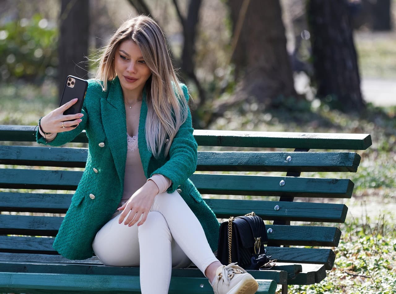 Woman using a banking app on her phone, illustrating Lumin Signal digital banking analytics