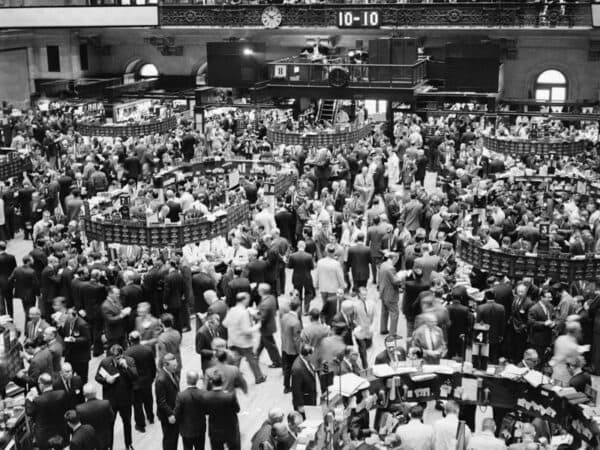 Modern investing revolution illustrated by trading floor data screens, index fund charts, and portfolio diversification concepts