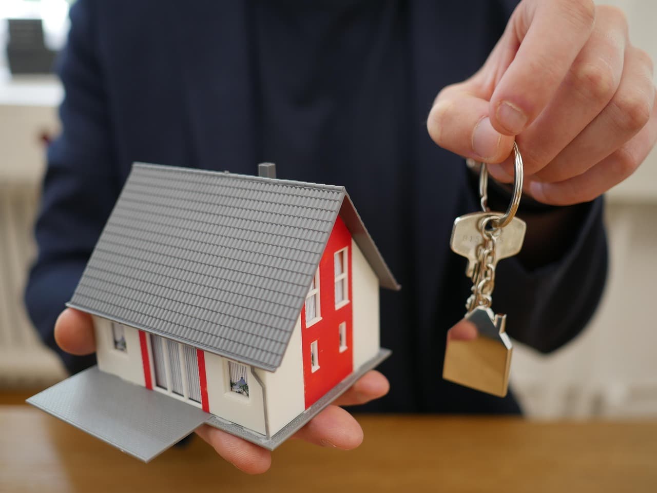 House keys handed over at closing, illustrating PollyOS mortgage capital markets software