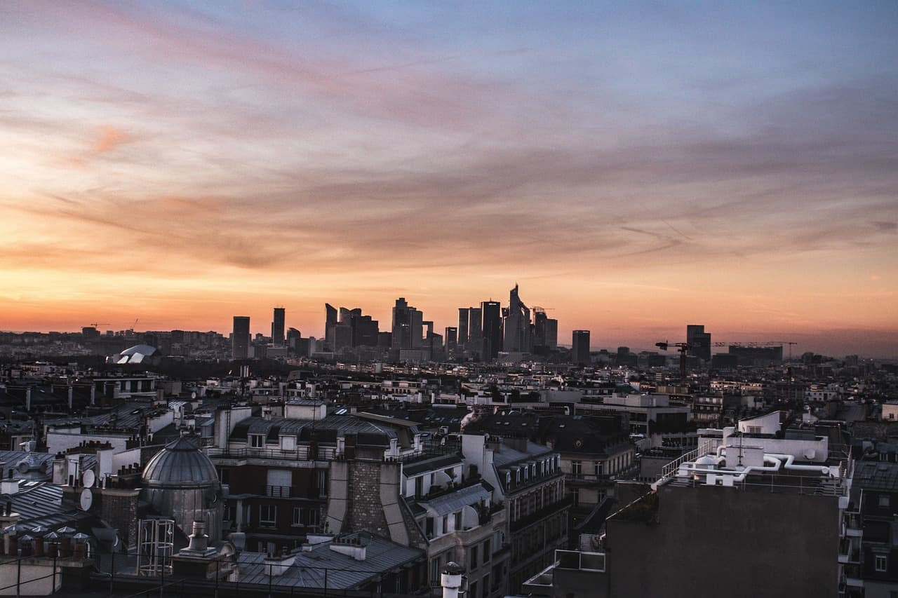 Paris skyline at dusk, home city of open finance provider Powens and its connectors
